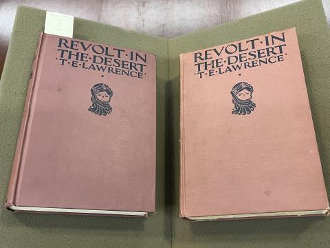 Two copies of The Revolt in the Desert. The Special Collections copy is on the left and Amanda's copy is on the right